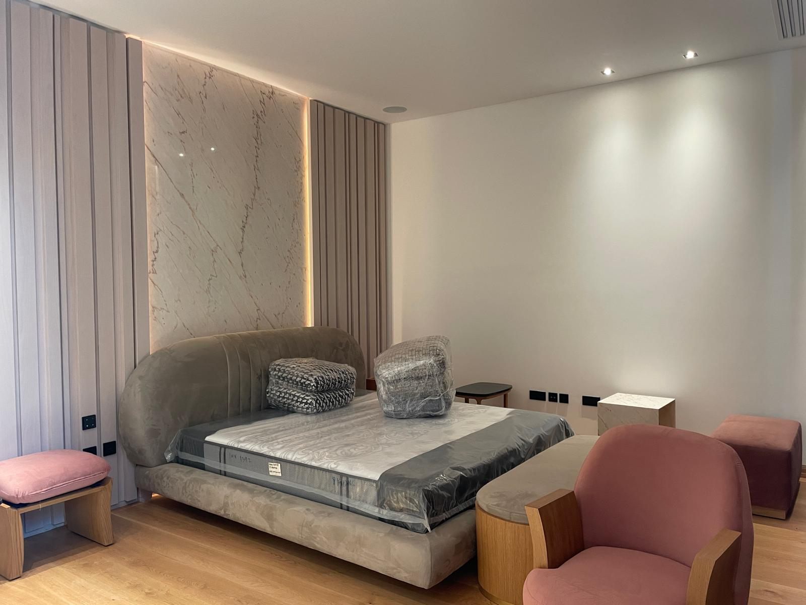 Backlit marble feature wall in a villa bedroom