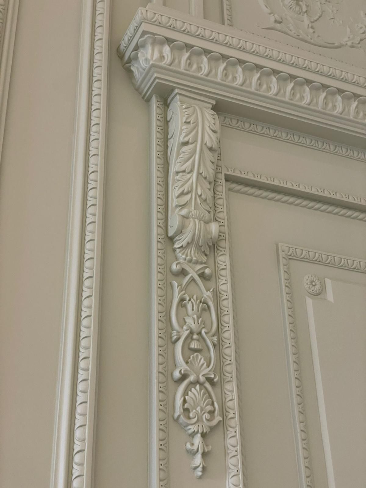 Hand-carved cornice and corbel detail