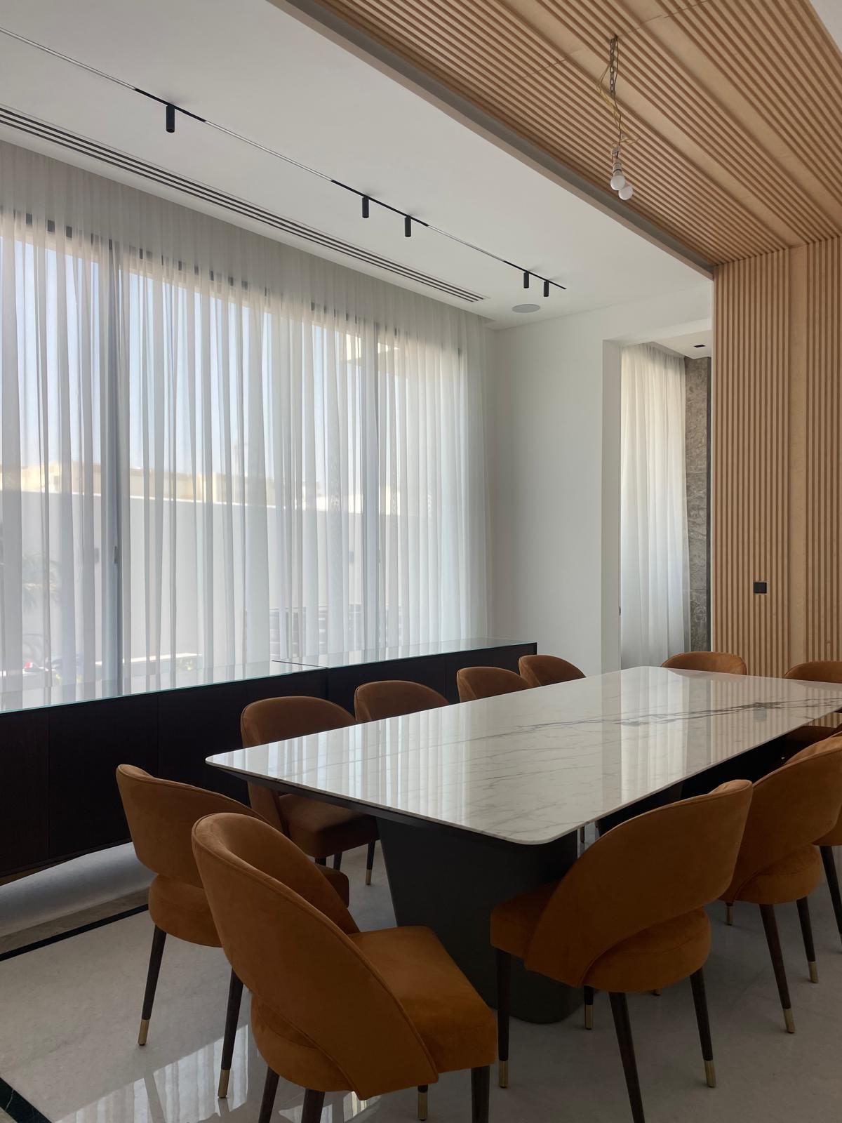 Glazed office partition with fluted timber detailing